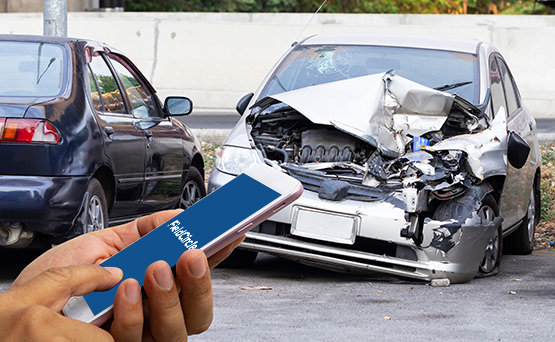 Individual using Zapium mobile app inspecting a car accident